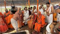 The Raksha prasad from the Yajna Kunda being offered to H.H. Swamiji